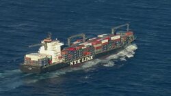Aerial shot of cargo ship transporting shipping containers. Stock Footage