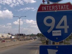 Interstate 94 Sign With Traffic Behind It Stock Footage