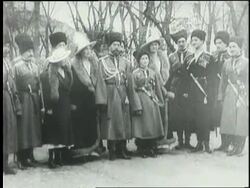 Czar Nicholas II and his family stand outdoors together in full winter dress. Stock Footage