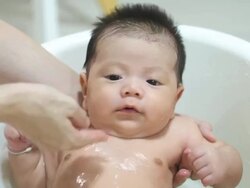 Baby taking a bath Stock Footage