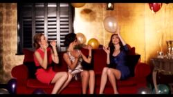 Three women sat playing with balloons Stock Footage