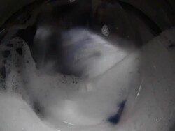 Laundry inside a washing machine drum Stock Footage