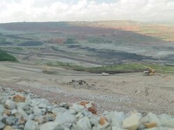 Truck loading coal mine to automatic conveyor Stock Footage