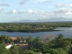 WS, PAN, Brazil, Ceara, Fortaleza, Lake and mountain range in background Stock Footage