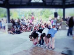 WS PAN Breakdancer performing and jumping over group of people  / Mississauga, Ontario, Canada. Stock Footage