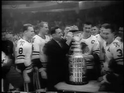 B/W 1961 Chicago Blackhawks posing with trophy at Stanley Cup / Detroit / newsreel Stock Footage