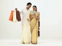 South Indian couple showing shopping bags and money  Stock Footage