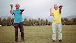 DS Senior men doing hand weight exercises in park Stock Footage