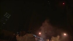 Fireworks sparkle and explode in front of spectators in Beijing. Stock Footage