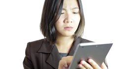 Woman use Digital Tablet on White Background Stock Footage
