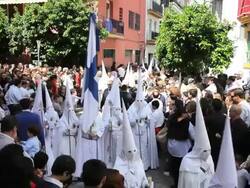 People watching the Hooded Nazarenos parade during the celebration of Semana Santa a Holy week in Malaga Spain, Europe Stock Footage