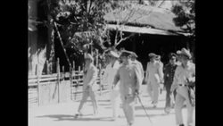 CAN435 A GENERAL VISITS VILLAGE, SEES CAPTURED WEAPONS Instructional Video