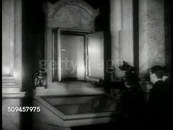 1937: U.S. CONSTITUTION: EXT WS Library of Congress. Guard w/ visitors pointing to US Constitution on display. CU Protective display case w/ glass top. TD CU Articles V, VI, VII & signatures below. Instructional Video