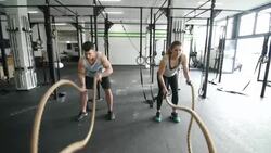 Slow motion capture of a crossfit battle rope exercise Stock Footage
