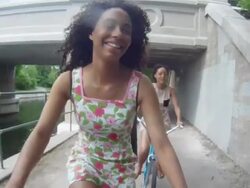 MS POV Two young girls having fun and riding bicycles in urban area near lake and inside park / Minneapolis, Minnesota, United States Stock Footage