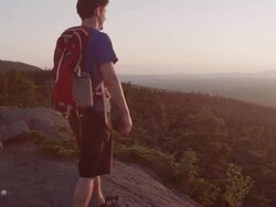 MS PAN Shot of Two men hikiing top of mountain peak in 100 Mile Wilderness of Northern / Maine, United States Stock Footage