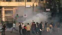 Tear gas fired at protesters; night shots of demos News Clip