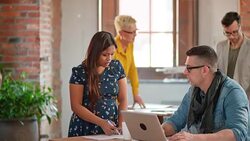 Colleagues in startup office discussing project Stock Footage