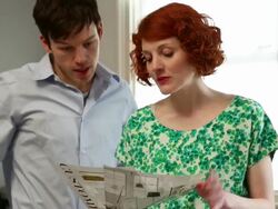 MS TU TD Shot of woman looking at mood boards, asking male colleque for advice in office / London, United Kingdom Stock Footage