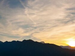 T/L of Lake Idro and paragliders at sunset / Lago Idro, Bavaria, Germany Stock Footage