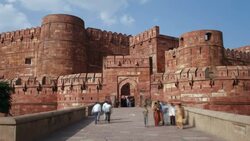 Tourists share a walkway as they visit the Red Fort in Old Delhi. Stock Footage