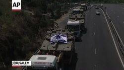 Hamas militants fire rockets towards Israel as an Israeli airstrike on the Gaza Strip can be seen from the border. (July 12) News Clip