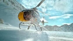 SLO MO Helicopter rotors make ice particles shine in sun Stock Footage