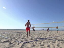 Men playing beach volleyball. - Slow Motion - filmed at 240 fps Stock Footage