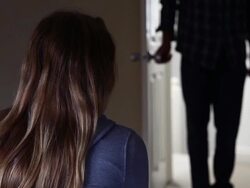 Girl at home back view, man entering room. Stock Footage