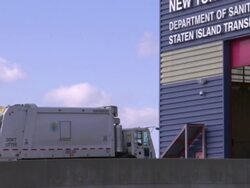 A garbage truck enters New York City's department of sanitation building. Stock Footage