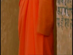 CU tilt up to Hindu priest tying head scarf, Bandhavgarh National Park, India Stock Footage