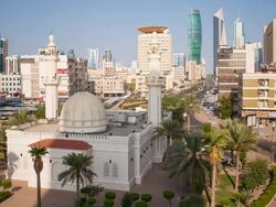 Arabian Peninsula, Kuwait, Kuwait City, time lapse of the modern city centre architecture and traditional mosque Stock Footage