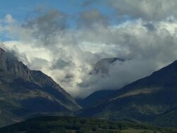 AERIAL WS Clouds floating above mountain peaks in Maritime Alpes / Rhone-Alpes, France Stock Footage