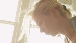 A mature woman works out with an exercise ball in her home gym. Stock Footage