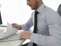 Businessman looking at tax forms Stock Footage