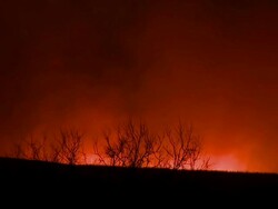 MS Night scene of lightning fire on prairie with intense smoke / Oklahoma, United States Stock Footage