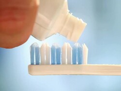 Toothbrush and toothpaste Stock Footage