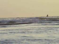 WS SLO MO View of paddle boarder in surf / Astoria, Oregon, United States  Stock Footage