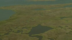 Marshes surround an oil rig. Stock Footage