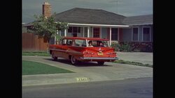 MS Family in car backing out of driveway / United States Stock Footage