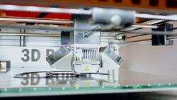 3D printer in action printing out object Stock Footage