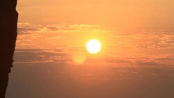 Sunrise through flowing cloud waves, mountain Stock Footage
