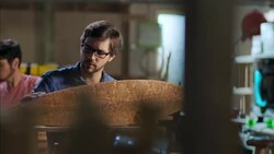 Young craftsmen work on various projects in modern wood shop Stock Footage