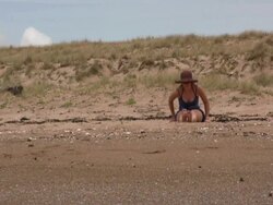 Beach Yoga: Sitting Forward Stretches Stock Footage