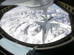 WS F-16 fighter jet approaching and refueling in mid-air, Colorado Rockies, Colorado, USA Stock Footage