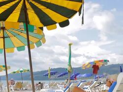 Woman relaxing on the beach Stock Footage