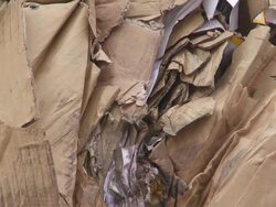 Piles of Cardboard Waste TILT UP Stock Footage