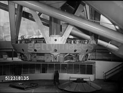1953: PALOMAR OBSERVATORY: WS Hale telescope dome rotating. HA WS 200 inch Hale telescope on angled equatorial mount, VS Moving, Unidentified technician operating control board.   Private, Caltech. Note: Largest aperture optical telescope 1948 to1976 Instructional Video