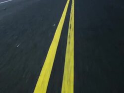 HD LOOPING: Double yellow line Stock Footage