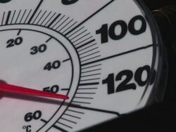ECU Shot of dial thermometer reading hot 130 degrees F, 53 degrees C during heat wave / Texas, United States Stock Footage